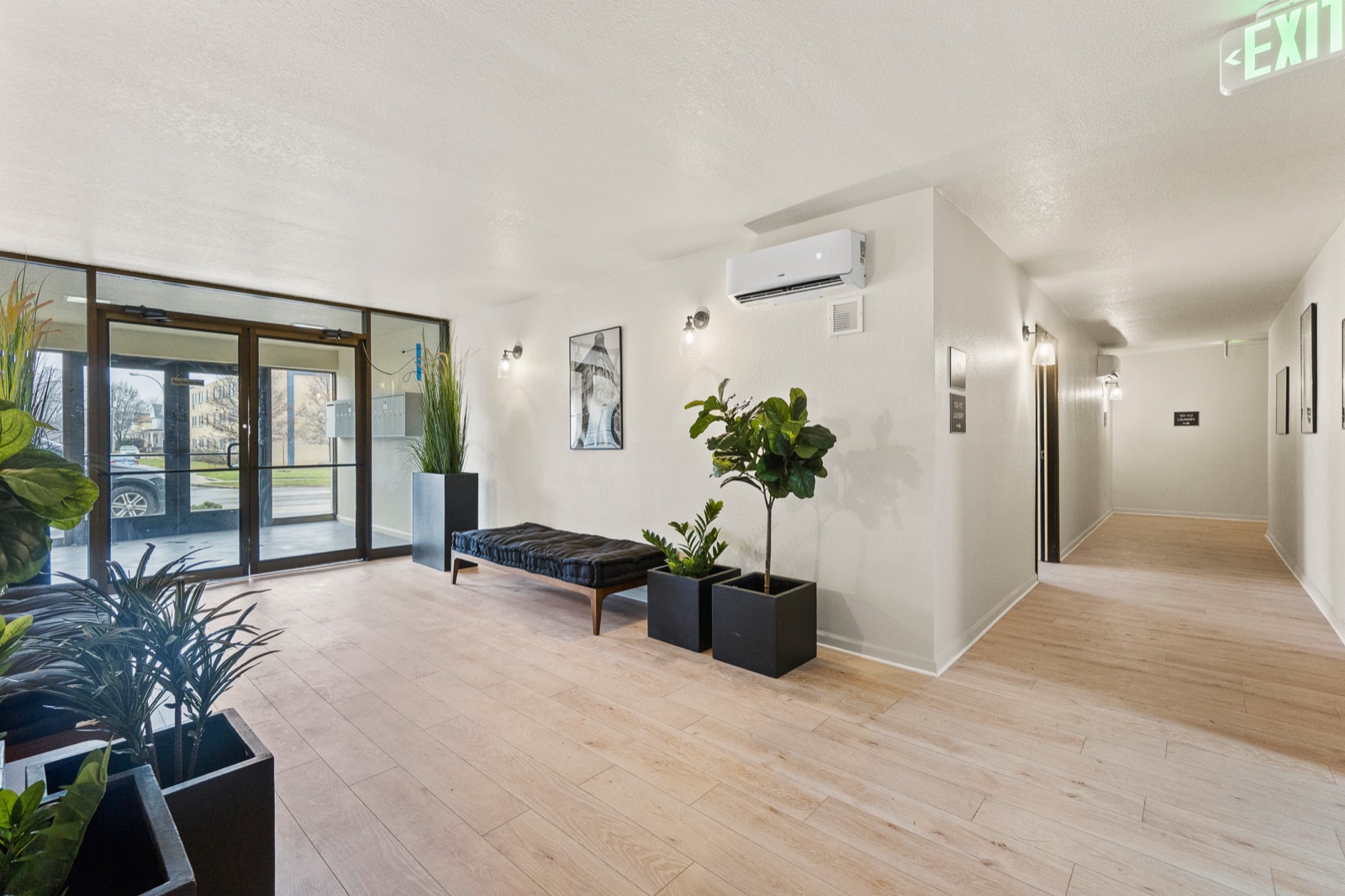Building lobby with glass entry doors and plants